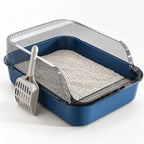 Blue high sided cat litter box with transparent splash guard, open top entry, litter tray and included scoop on white background.