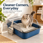 Cat standing inside a blue open top litter box with transparent high sides and scoop in a bright home interior.