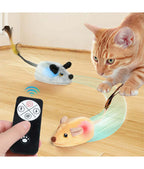 Cat playing with a remote-controlled toy mouse on a wooden floor.- AZPaws
