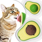 Cat playing with an avocado-shaped toy