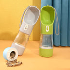 Pet water bottle with a small container of treats on a colorful background